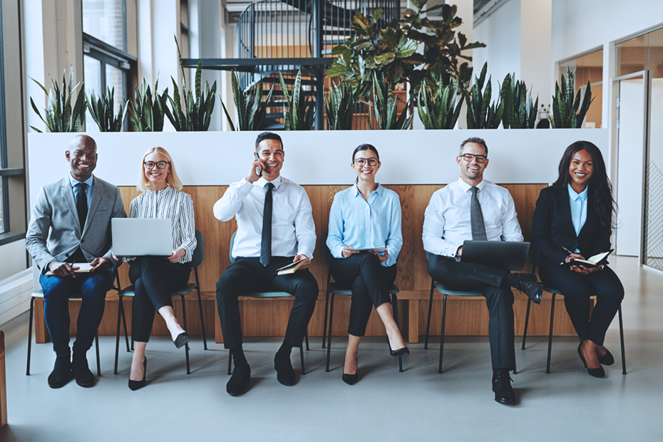 Group of diverse professionals seated in a modern office environment, symbolizing career opportunities and professional growth.