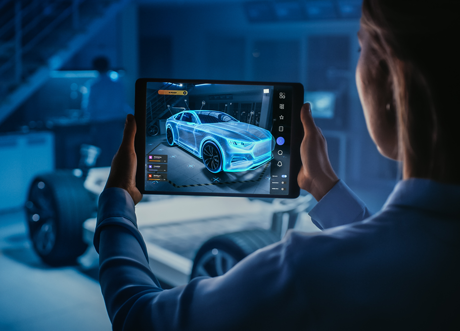 An RLE International engineer works on a project, using a tablet to display a 3D simulated car model as part of advanced automotive development within project business.