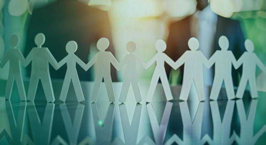 A row of paper cutout figures holding hands reflects teamwork and collaboration, with a professional business setting in the background, aligning with the company's commitment to social responsibility.