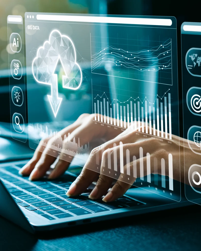 Person typing on laptop with holographic data interface showing global analytics and regional performance charts.